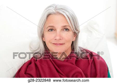 portrait of a beautiful smiling, mature woman, wrapped in a red shawl View Large Photo Image Stock Photo - portrait of a beautiful smiling, mature woman, wrapped in a red shawl. Fotosearch