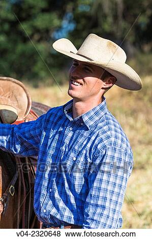 Portrait of a wrangler (cowboy), California, USA View Large Photo Image Stock Photo - Portrait of a wrangler (cowboy), California, USA. Fotosearch