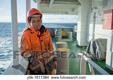 Portrait of an Indonesian seaman or sailor on the container-vessel MV Flintercape, during a journey from Rotterdam, Netherlands, to Sundsvall, Sweden. The man is an 'Able Seaman', who generally works on deck. View Large Photo Image Picture - Portrait of an Indonesian seaman or sailor on the container-vessel MV Flintercape, during a journey from Rotterdam, Netherlands, to Sundsvall, Sweden. The man is an 'Able Seaman', who generally works on deck.. Fotosearch