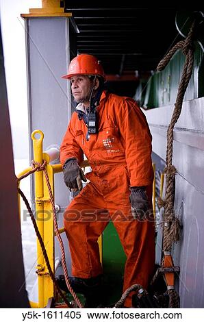Stock Photography - Portrait of an Indonesian seaman or sailor on the container-vessel MV Flintercape, during a journey from Rotterdam, Netherlands, to Sundsvall, Sweden. The man is an 'Able Seaman', who generally works on deck.. Fotosearch