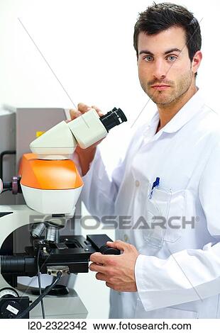 Stock Image - Researcher. Microscope. Technological Services to Industry. Tecnalia Research and Innovation, Donostia, San Sebastian, Gipuzkoa, Basque Country, Spain.. Fotosearch