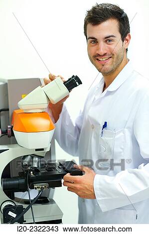 Stock Image - Researcher. Microscope. Technological Services to Industry. Tecnalia Research and Innovation, Donostia, San Sebastian, Gipuzkoa, Basque Country, Spain.. Fotosearch