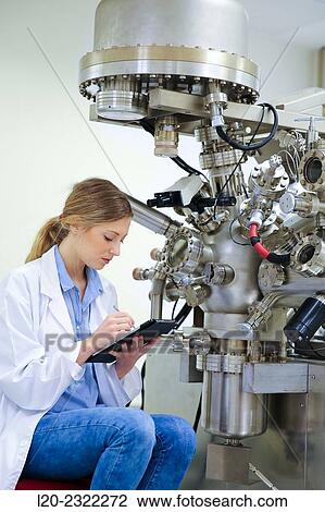 Stock Image - Researcher. Surface spectrometer, Photoelectron spectroscopy, Auger Electron Spectroscopy, AES, VG Scientific ESCAlab 200D Surface Analysis Equipment.. Fotosearch