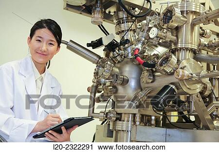 Stock Image - Researcher. Surface spectrometer, Photoelectron spectroscopy, Auger Electron Spectroscopy, AES, VG Scientific ESCAlab 200D Surface Analysis Equipment.. Fotosearch