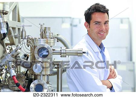 Stock Image - Researcher. Surface spectrometer, Photoelectron spectroscopy, Auger Electron Spectroscopy, AES, VG Scientific ESCAlab 200D Surface Analysis Equipment.. Fotosearch