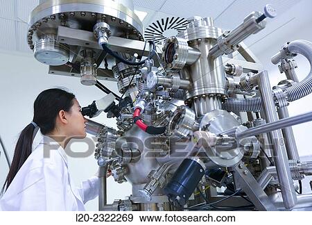 Stock Photo - Researcher. Surface spectrometer, Photoelectron spectroscopy, Auger Electron Spectroscopy, AES, VG Scientific ESCAlab 200D Surface Analysis Equipment.. Fotosearch
