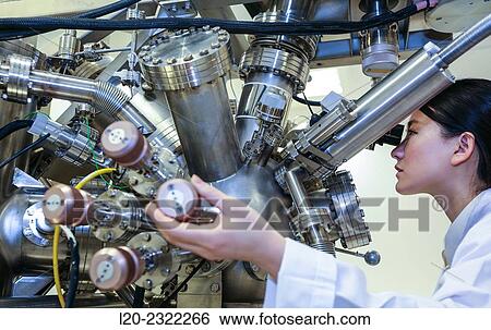 Researcher. Surface spectrometer, Photoelectron spectroscopy, Auger Electron Spectroscopy, AES, VG Scientific ESCAlab 200D Surface Analysis Equipment. View Large Photo Image Stock Photograph - Researcher. Surface spectrometer, Photoelectron spectroscopy, Auger Electron Spectroscopy, AES, VG Scientific ESCAlab 200D Surface Analysis Equipment.. Fotosearch