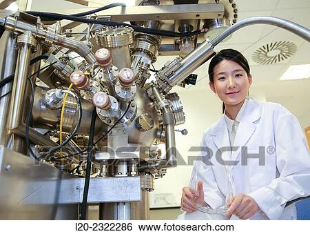 Stock Photograph - Researcher. Surface spectrometer, Photoelectron spectroscopy, Auger Electron Spectroscopy, AES, VG Scientific ESCAlab 200D Surface Analysis Equipment.. Fotosearch
