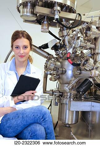 Stock Photograph - Researcher. Surface spectrometer, Photoelectron spectroscopy, Auger Electron Spectroscopy, AES, VG Scientific ESCAlab 200D Surface Analysis Equipment.. Fotosearch