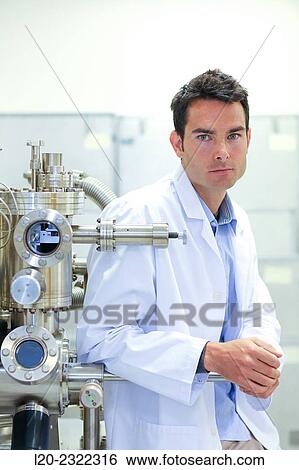 Stock Photograph - Researcher. Surface spectrometer, Photoelectron spectroscopy, Auger Electron Spectroscopy, AES, VG Scientific ESCAlab 200D Surface Analysis Equipment.. Fotosearch