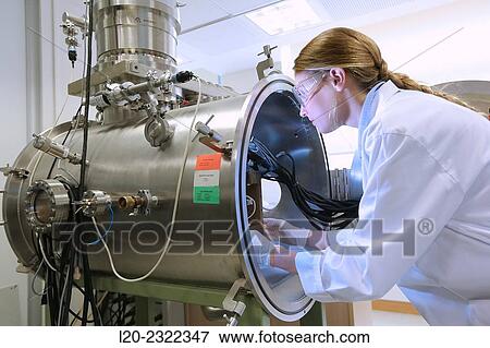 Stock Photo - Researcher. Vacuum chamber for tribological measurements. Laboratory surfaces. Tecnalia Research and Innovation. Donostia. San Sebastian. Gipuzkoa. Basque Country. Spain. Europe.. Fotosearch
