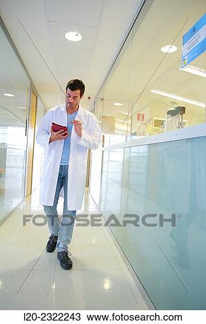 Researcher walking in hallway laboratory. Chemical Analysis Laboratory. Technological Services to Industry. Tecnalia Research and Innovation, Donostia, San Sebastian, Gipuzkoa, Basque Country, Spain. View Large Photo Image Stock Image - Researcher walking in hallway laboratory. Chemical Analysis Laboratory. Technological Services to Industry. Tecnalia Research and Innovation, Donostia, San Sebastian, Gipuzkoa, Basque Country, Spain.. Fotosearch