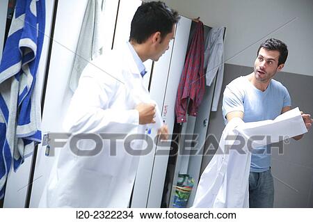Researchers in the dressing room. White coats. Technological Services to Industry. Tecnalia Research and Innovation, Donostia, San Sebastian, Gipuzkoa, Basque Country, Spain. View Large Photo Image Picture - Researchers in the dressing room. White coats. Technological Services to Industry. Tecnalia Research and Innovation, Donostia, San Sebastian, Gipuzkoa, Basque Country, Spain.. Fotosearch