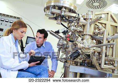Picture - Researchers. Surface spectrometer, Photoelectron spectroscopy, Auger Electron Spectroscopy, AES, VG Scientific ESCAlab 200D Surface Analysis Equipment. Donostia, San Sebastian, Gipuzkoa, Basque Country, Spain.. Fotosearch