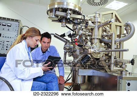Stock Photograph - Researchers. Surface spectrometer, Photoelectron spectroscopy, Auger Electron Spectroscopy, AES, VG Scientific ESCAlab 200D Surface Analysis Equipment. Donostia, San Sebastian, Gipuzkoa, Basque Country, Spain.. Fotosearch
