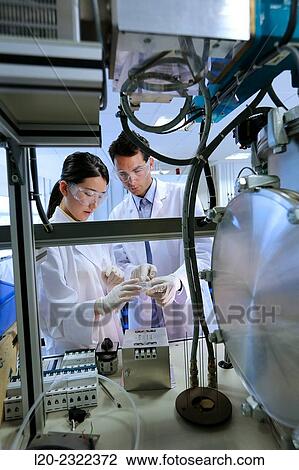 Stock Image - Researchers. Vacuum chamber microwave plasma. Laboratory surfaces. Tecnalia Research and Innovation. Donostia. San Sebastian. Gipuzkoa. Basque Country. Spain. Europe.. Fotosearch