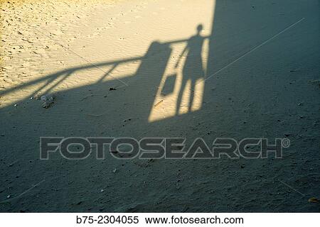 Shadow silhouette of a woman with a shopping bag, Tel Aviv, Israel, Middle East View Large Photo Image Stock Photography - Shadow silhouette of a woman with a shopping bag, Tel Aviv, Israel, Middle East. Fotosearch