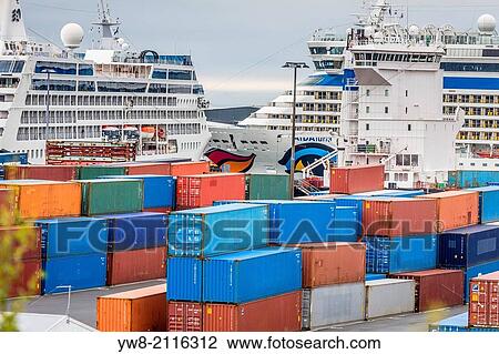 Stock Image - Shipping containers with Large Cruise ships in the background, Reykjavik Harbor, Iceland.. Fotosearch