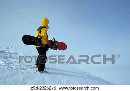 Snowboarder on ridge, Hudson Bay Mountain, Smithers, BC. View Large Photo Image Stock Photography - Snowboarder on ridge, Hudson Bay Mountain, Smithers, BC.. Fotosearch