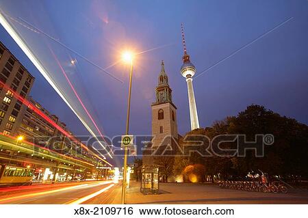 Stock Photograph - St. Mary's Church and the TV Tower in Alexanderplatz, Berlin.. Fotosearch