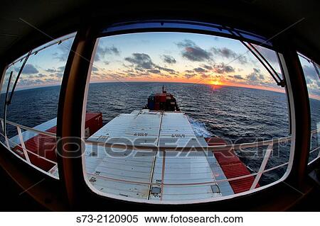 Sunset from inside of a container transport in the Mediterranean, Spain View Large Photo Image Stock Photography - Sunset from inside of a container transport in the Mediterranean, Spain. Fotosearch