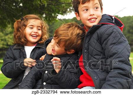 Three children smiling, Guadarrama National Park, Madrid, Spain View Large Photo Image Picture - Three children smiling, Guadarrama National Park, Madrid, Spain. Fotosearch