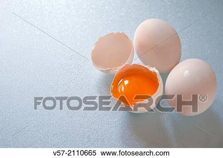 Three white eggs, one of them cracked. View Large Photo Image Stock Photography - Three white eggs, one of them cracked.. Fotosearch