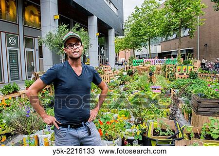 Stock Image - Tilburg, Netherlands. Bram is an Urban Gardener, maintaining his urban kitchen garden down town Tilburg.. Fotosearch