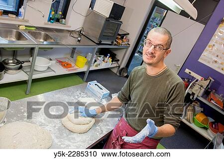 Tilburg, Netherlands. Middle aged baker preparing his dough before baking his bread. View Large Photo Image Stock Image - Tilburg, Netherlands. Middle aged baker preparing his dough before baking his bread.. Fotosearch