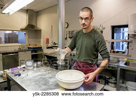 Tilburg, Netherlands. Middle aged baker preparing his dough before baking his bread. View Large Photo Image Stock Photo - Tilburg, Netherlands. Middle aged baker preparing his dough before baking his bread.. Fotosearch