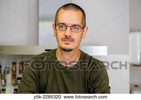 Tilburg, Netherlands. Portrait of a middle aged baker in his kitchen. View Large Photo Image Stock Image - Tilburg, Netherlands. Portrait of a middle aged baker in his kitchen.. Fotosearch