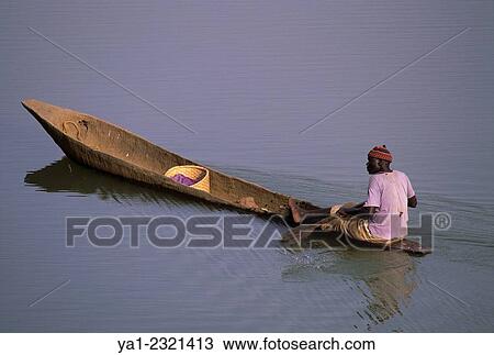 Traditional canoe on Gambia river, Parc national de Niokolo Koba, Senegal. View Large Photo Image Stock Image - Traditional canoe on Gambia river, Parc national de Niokolo Koba, Senegal.. Fotosearch
