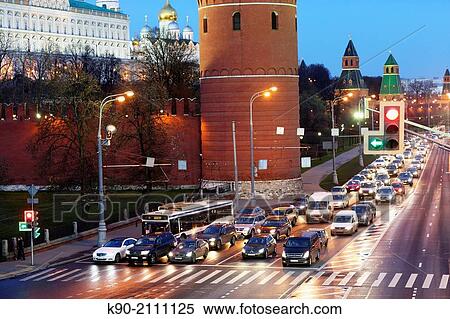 Stock Photography - Traffic on the road along the embankment at the Kremlin side in the early evening, Moscow, Russia, Europe.. Fotosearch