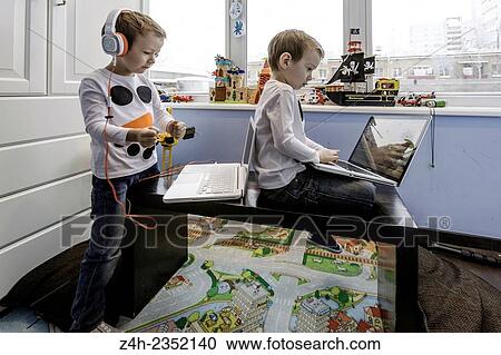 Stock Image - Twins brothers.. Fotosearch