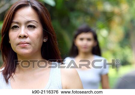 Two asian women jogging in the garden, Jakarta, Indonesia, Southeast Asia. View Large Photo Image Stock Photograph - Two asian women jogging in the garden, Jakarta, Indonesia, Southeast Asia.. Fotosearch