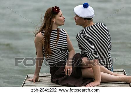 Two young men on the riverbank. View Large Photo Image Stock Image - Two young men on the riverbank.. Fotosearch