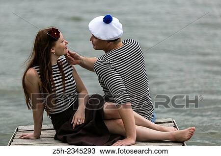 Two young men on the riverbank. View Large Photo Image Stock Image - Two young men on the riverbank.. Fotosearch