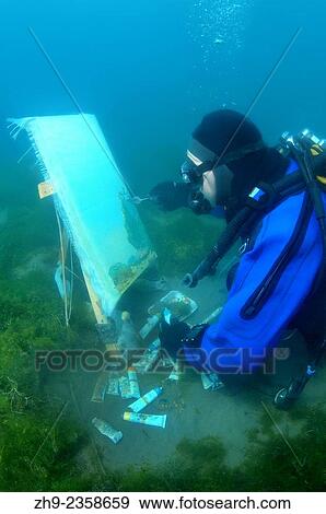 Underwater artist Yuriy Alexeev (Yuri Alekseev) paints a picture under water. Lake Baikal, Listvyanka, Irkutsky District, Irkutsk Oblast, Siberia, Russia, Eurasia. View Large Photo Image Stock Photo - Underwater artist Yuriy Alexeev (Yuri Alekseev) paints a picture under water. Lake Baikal, Listvyanka, Irkutsky District, Irkutsk Oblast, Siberia, Russia, Eurasia.. Fotosearch