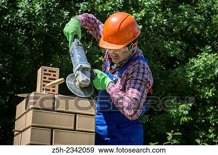 Welder assembly of individual houses. View Large Photo Image Stock Photo - Welder assembly of individual houses.. Fotosearch