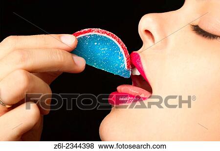 woman eating candy. View Large Photo Image Stock Photo - woman eating candy.. Fotosearch