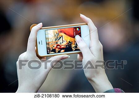 Woman takes photos on her mobile phone-close-up. View Large Photo Image Stock Image - Woman takes photos on her mobile phone-close-up.. Fotosearch