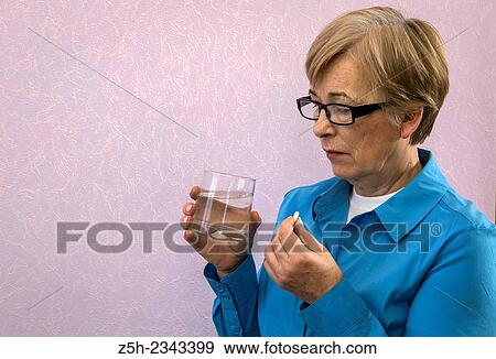 Woman taking pills. View Large Photo Image Stock Photo - Woman taking pills.. Fotosearch