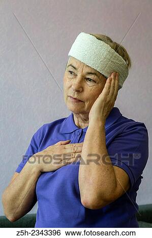 Stock Photograph - Woman with headache.. Fotosearch