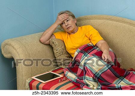 Stock Photography - Woman with headache.. Fotosearch
