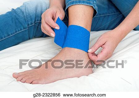 Woman's foot and ankle with blue bandage strap View Large Photo Image Stock Photograph - Woman's foot and ankle with blue bandage strap. Fotosearch