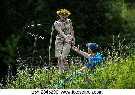 Young couple with an agricultural tool in the field. View Large Photo Image Stock Image - Young couple with an agricultural tool in the field.. Fotosearch