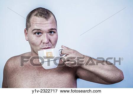 Young man drinking tea. View Large Photo Image Stock Photo - Young man drinking tea.. Fotosearch