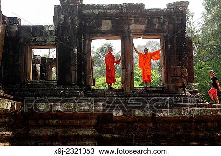 Young monks in Bayon Temple, Angkor, Siem Reap. Cambodia View Large Photo Image Stock Image - Young monks in Bayon Temple, Angkor, Siem Reap. Cambodia. Fotosearch