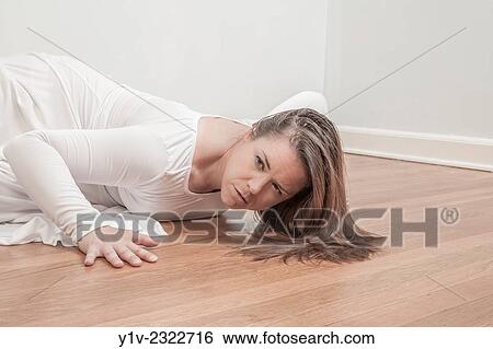 Stock Photograph - Young woman dancing.. Fotosearch