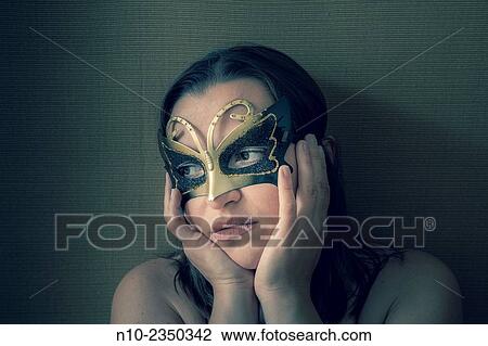 Young woman wearing a mask. View Large Photo Image Stock Image - Young woman wearing a mask.. Fotosearch